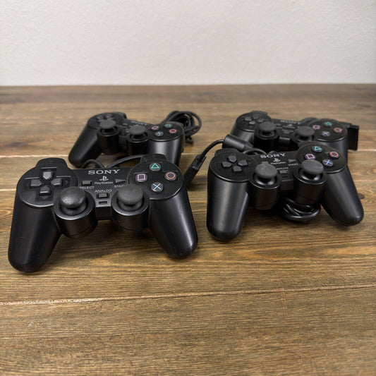 Lot of 4 Sony Playstation 2 PS2 OEM Dualshock 2 Controllers FOR PARTS / REPAIR