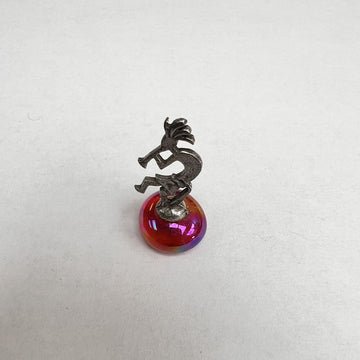 Miniature Silvertone Kokopelli Dancer on Iridescent Red Rock Figurine